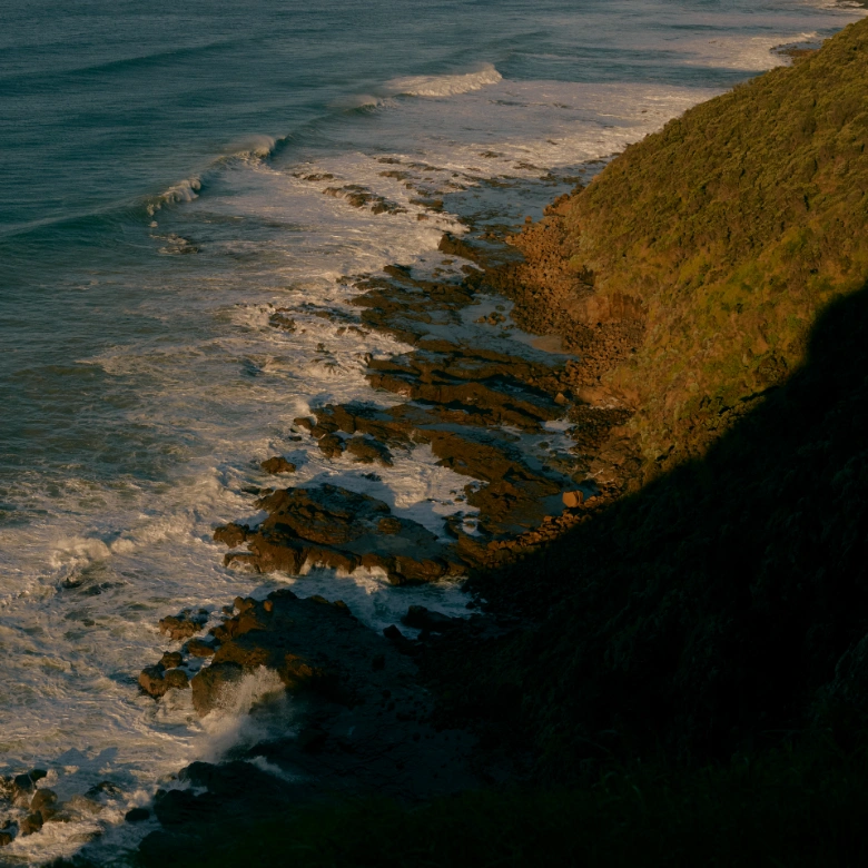 Rugged beach coastline with rocks and waves
